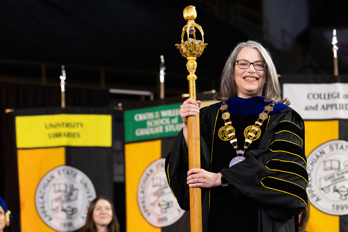 Dr. Heather Hulburt Norris holding the Mace